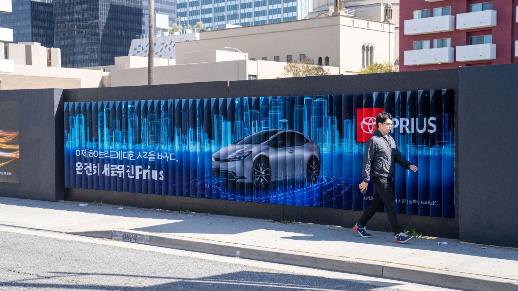 Toyota Prius Lenticular Right View Man Walking LA Koreatown Out-of-Home Advertising