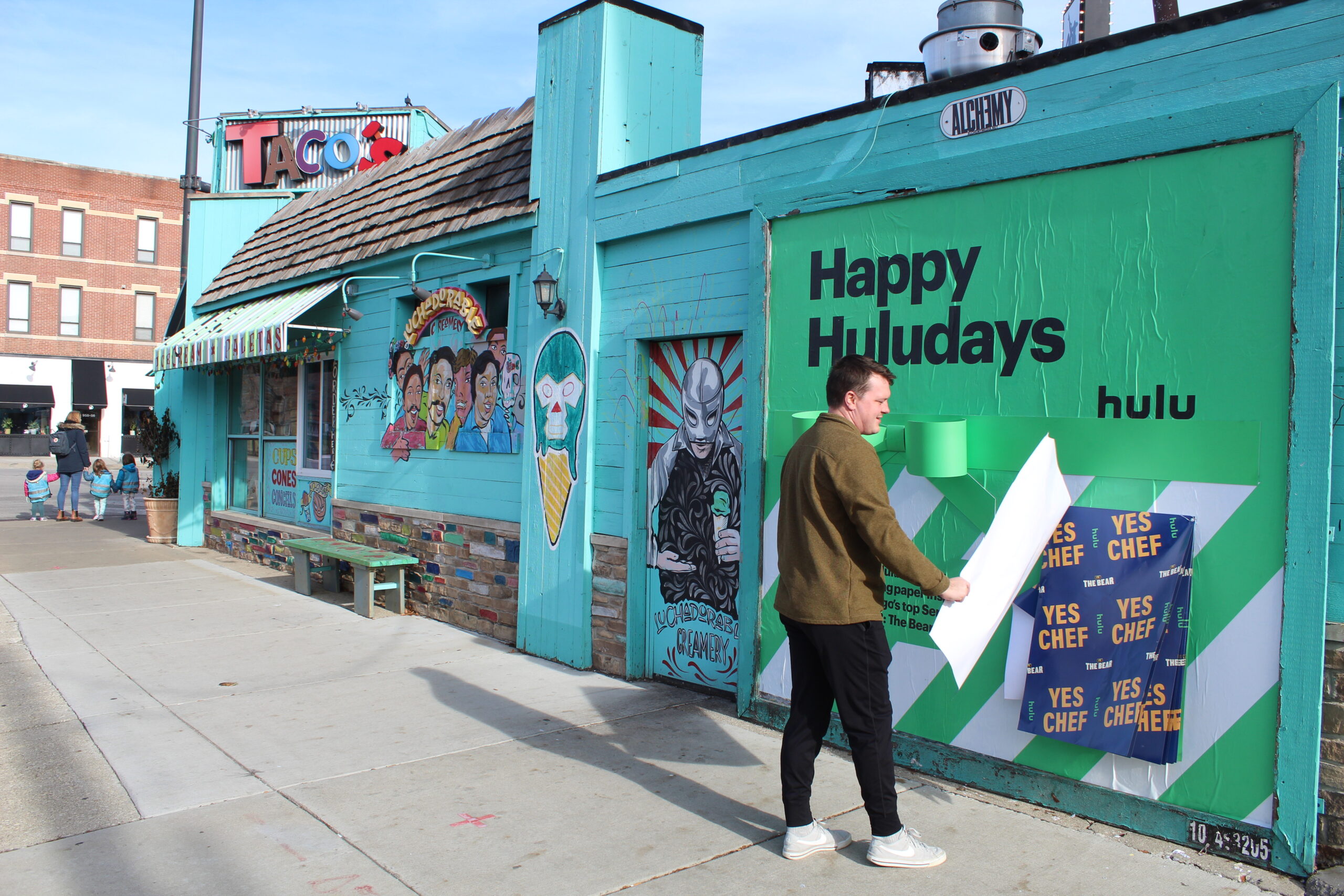Hulu Holidays Experiential Activation The Bear Man Pulling Off Wrapping Paper Chicago N Lincoln Ave and N Sheffield Ave